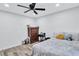 Serene bedroom with wood floors, a ceiling fan, and a calming ambiance, ideal for a restful retreat at 175 Hunters Gln, Fayetteville, GA 30215
