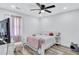 Inviting bedroom features wood floors, soft lighting, and a comfortable space for relaxation and rest at 175 Hunters Gln, Fayetteville, GA 30215