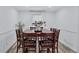 Formal dining room with classic wood furniture, wainscoting, and hardwood floors at 175 Hunters Gln, Fayetteville, GA 30215