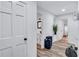 Bright hallway features hardwood floors, white walls, and doors, creating a modern, welcoming space at 175 Hunters Gln, Fayetteville, GA 30215