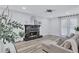 Inviting living room with a decorative fireplace, neutral tones, and ample natural light creating a cozy atmosphere at 175 Hunters Gln, Fayetteville, GA 30215