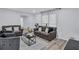 Comfortable living room featuring neutral tones, contemporary furniture, and plenty of natural light at 175 Hunters Gln, Fayetteville, GA 30215
