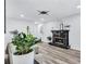 Bright living room with a black fireplace, neutral furniture, and a modern ceiling fan and plenty of natural light at 175 Hunters Gln, Fayetteville, GA 30215