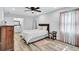 Bright and spacious main bedroom with wood floors, soft decor, and plenty of natural light creating a relaxing ambiance at 175 Hunters Gln, Fayetteville, GA 30215
