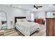 Serene main bedroom with soft lighting, wood floors, and neutral decor, providing a peaceful retreat at 175 Hunters Gln, Fayetteville, GA 30215