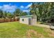 Backyard view of a functional shed with easy access, perfect for storage or a workshop at 175 Hunters Gln, Fayetteville, GA 30215