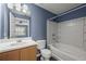 This bathroom includes a shower and bathtub, a sink and toilet at 3303 Par Three Way, Lithonia, GA 30038