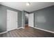 Cozy bedroom featuring a window, hard wood floors, and plenty of space at 3303 Par Three Way, Lithonia, GA 30038