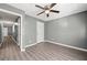 Bedroom features wood-look floors, ceiling fan and great natural light at 3303 Par Three Way, Lithonia, GA 30038