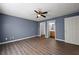 A bedroom featuring hardwood floors, ceiling fan, closet and bathroom at 3303 Par Three Way, Lithonia, GA 30038
