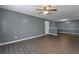Open-concept living room featuring hard wood floors and light-grey paint at 3303 Par Three Way, Lithonia, GA 30038