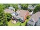 Aerial view of the property showing the lush backyard with a screened porch and patio at 3812 Mine Creek Ln, Marietta, GA 30062