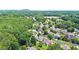 Community aerial showcases the neighborhood with tree-lined streets and lush landscaping at 3812 Mine Creek Ln, Marietta, GA 30062
