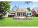 Expansive backyard featuring a well-maintained lawn, patio area, and screened-in porch at 3812 Mine Creek Ln, Marietta, GA 30062