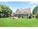 A well-maintained backyard featuring a patio, screen porch and lush lawn at 3812 Mine Creek Ln, Marietta, GA 30062