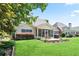 Spacious backyard featuring a well-maintained lawn, patio, and screened-in porch at 3812 Mine Creek Ln, Marietta, GA 30062