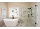 Contemporary bathroom featuring a freestanding tub and a walk-in shower at 3812 Mine Creek Ln, Marietta, GA 30062