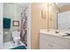Bathroom featuring floral shower curtain, a single vanity, and a toilet at 3812 Mine Creek Ln, Marietta, GA 30062