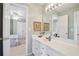 Bathroom with a long vanity and framed art, and a view to the bedroom at 3812 Mine Creek Ln, Marietta, GA 30062