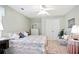 Light and airy bedroom with ceiling fan, neutral walls, and plush furnishings at 3812 Mine Creek Ln, Marietta, GA 30062