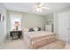 Inviting bedroom with cozy decor, sewing machine table, and plenty of natural light at 3812 Mine Creek Ln, Marietta, GA 30062