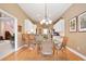 Bright dining area featuring a round glass table with seating for four and an elegant chandelier at 3812 Mine Creek Ln, Marietta, GA 30062