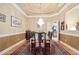 Well-lit dining room with a long table and seating for ten, perfect for Gathering dinners at 3812 Mine Creek Ln, Marietta, GA 30062