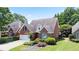 Beautiful brick home with manicured lawn and mature landscaping, offering great curb appeal at 3812 Mine Creek Ln, Marietta, GA 30062