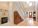 Inviting foyer with hardwood floors, high ceilings, and a staircase leading to the upper level at 3812 Mine Creek Ln, Marietta, GA 30062
