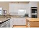 Updated kitchen with granite countertops, stainless steel appliances and white cabinets at 3812 Mine Creek Ln, Marietta, GA 30062