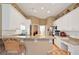 Spacious kitchen featuring granite countertops, white cabinets and a breakfast bar at 3812 Mine Creek Ln, Marietta, GA 30062