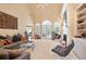 Bright living room features high ceilings, fireplace, built-ins, and French doors to the outside at 3812 Mine Creek Ln, Marietta, GA 30062