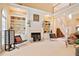 Open-concept living room with fireplace, built-in shelving, and staircase to the upper level at 3812 Mine Creek Ln, Marietta, GA 30062
