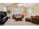 Cozy living room with vaulted ceilings, a comfortable sofa, and ample natural light at 3812 Mine Creek Ln, Marietta, GA 30062