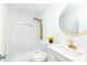Clean bathroom with a modern shower, vanity, and round mirror, creating a soothing atmosphere at 3554 Cherry Bloom Way, Decatur, GA 30034