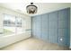Well-lit room featuring a paneled accent wall and a large window with blinds for optimal light control at 3554 Cherry Bloom Way, Decatur, GA 30034