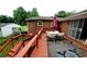 A back deck is staged with an outdoor dining table on patterned carpet at 3769 Amber Nw Rd, Atlanta, GA 30331