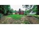 A tree-lined backyard with lawn at 3769 Amber Nw Rd, Atlanta, GA 30331