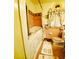 Cozy bathroom with walk-in bathtub, pink tile, and vintage accents at 3769 Amber Nw Rd, Atlanta, GA 30331