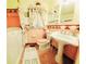 Retro bathroom featuring pink tile, vintage fixtures and decorative accents at 3769 Amber Nw Rd, Atlanta, GA 30331