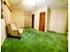 Cozy bedroom with vintage green carpeting and classic design elements at 3769 Amber Nw Rd, Atlanta, GA 30331