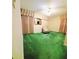 Spacious bedroom featuring vintage green carpeting and decor at 3769 Amber Nw Rd, Atlanta, GA 30331