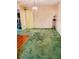 Open dining area leading to hallway, with chandelier and unique green carpet at 3769 Amber Nw Rd, Atlanta, GA 30331