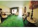 Inviting living room with classic furnishings, large windows, and vibrant green carpet at 3769 Amber Nw Rd, Atlanta, GA 30331