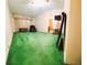Living room with vintage green carpeting and updated lighting fixtures at 3769 Amber Nw Rd, Atlanta, GA 30331