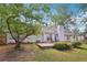 View of backyard featuring patio and mature trees providing shade and privacy at 600 Cowan Rd, Covington, GA 30016