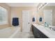 Bathroom featuring a double vanity with modern fixtures and a separate bathtub at 600 Cowan Rd, Covington, GA 30016