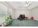 Bright bedroom featuring a large window, desk, and comfortable seating, perfect for work or relaxation at 600 Cowan Rd, Covington, GA 30016