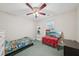 Bedroom featuring a ceiling fan and a bright window for natural light at 600 Cowan Rd, Covington, GA 30016