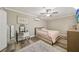 Charming bedroom featuring an accent wall, mirror, and wood-look floors at 600 Cowan Rd, Covington, GA 30016
